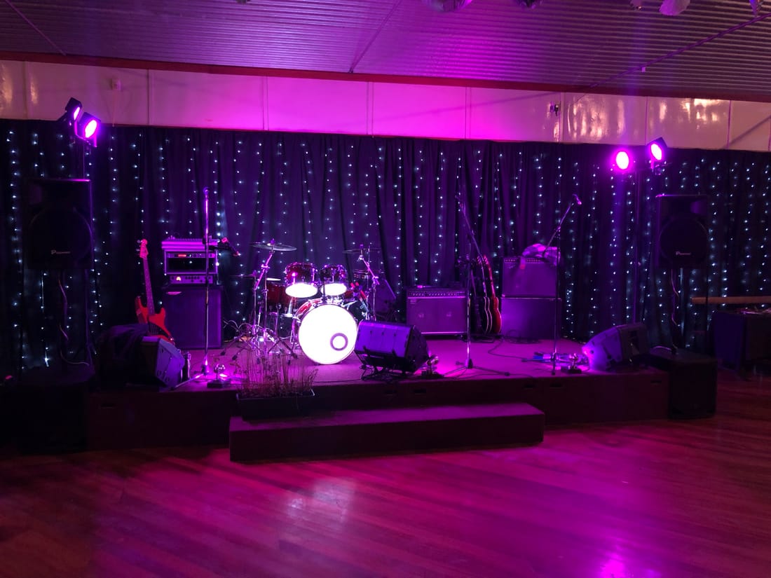 Midnight Cruise stage setup with purple lighting