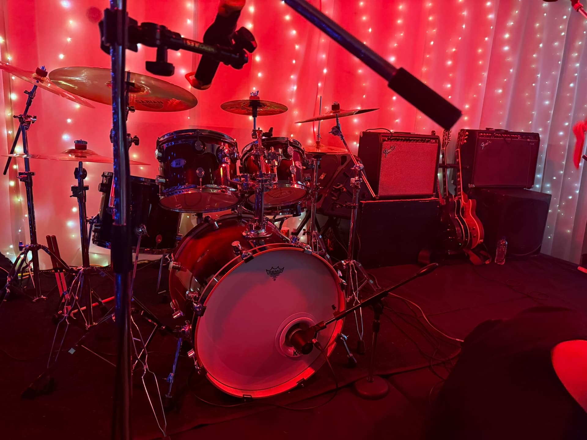 Midnight Cruise drum kit under red stage lights